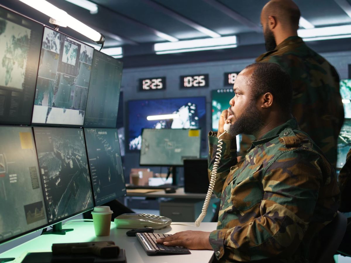 man on phone in command centre